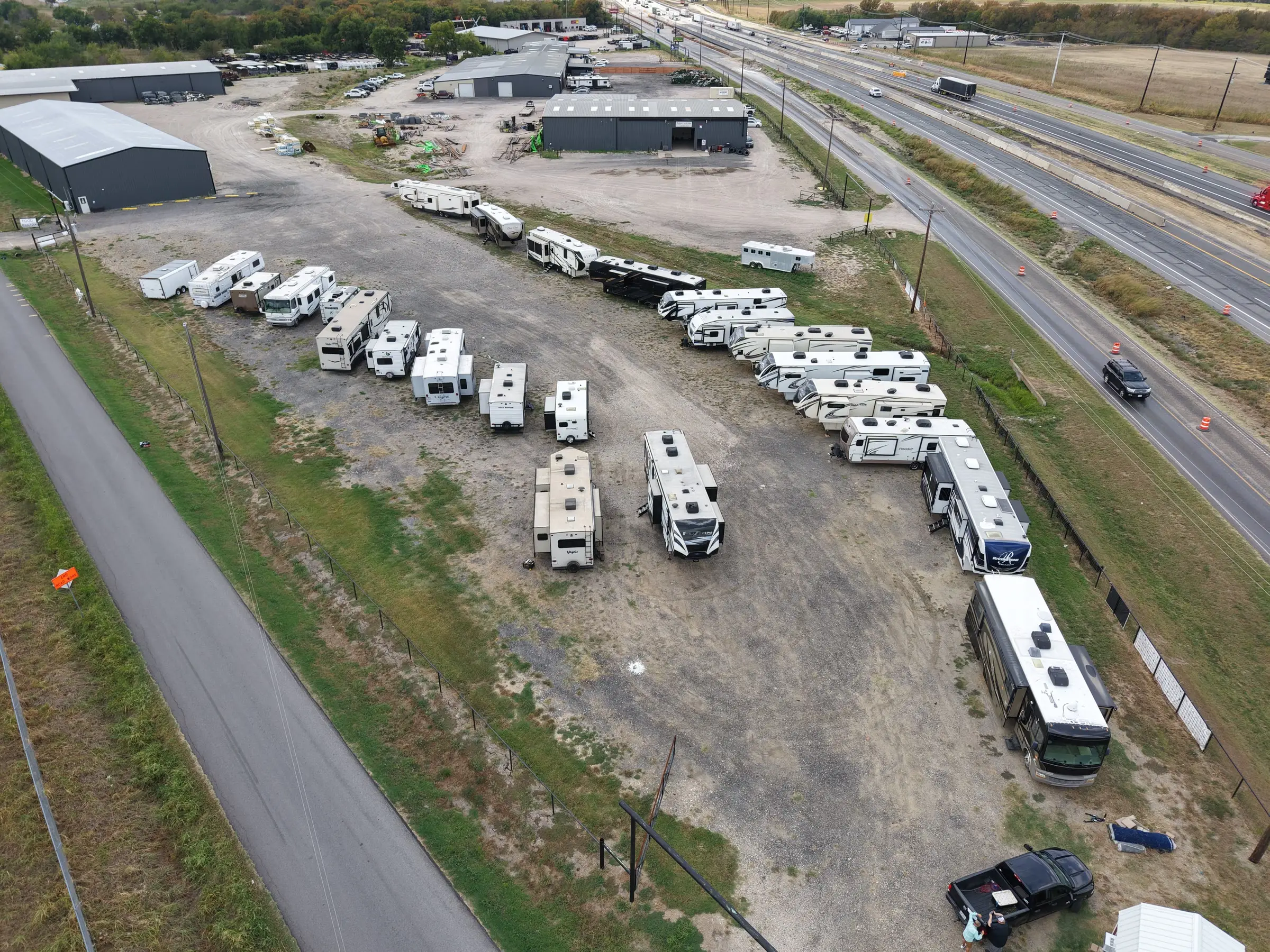 Aerial view down the BK Consignments RV lot alongside Interstate 30, the straight shot east from Rockwall to Greenville